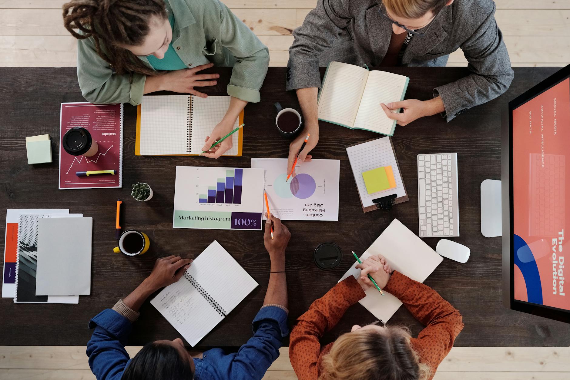 a group of people having a meeting in the office