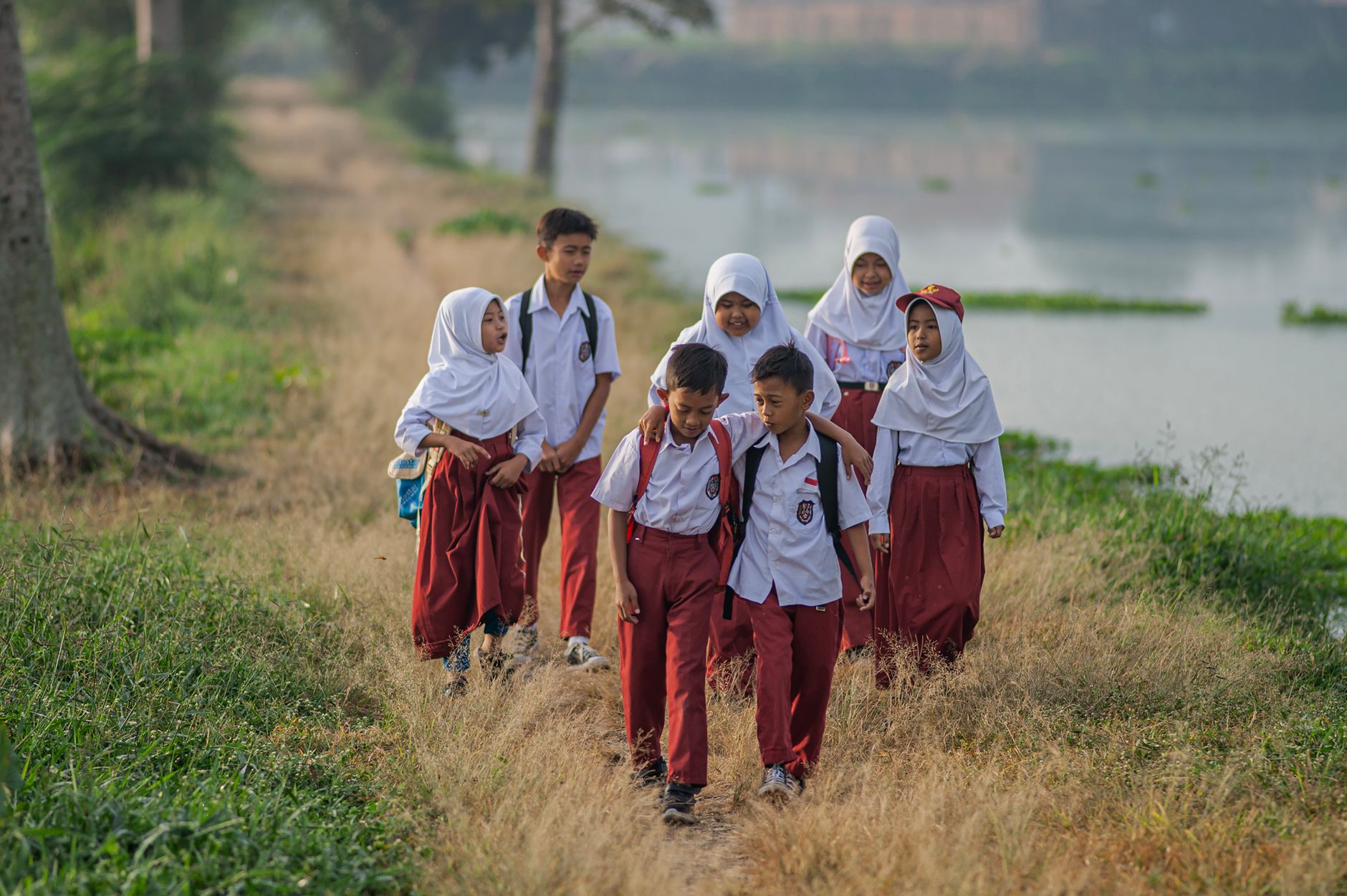 indonesian school children walking after class